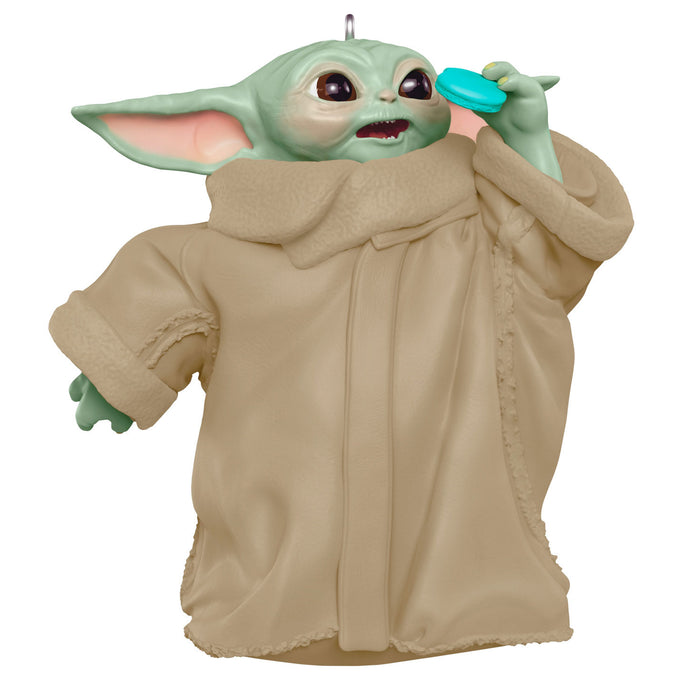 Decorative ornament resembling a character from a popular franchise, wearing a beige robe.