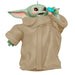 Decorative ornament resembling a character from a popular franchise, wearing a beige robe.