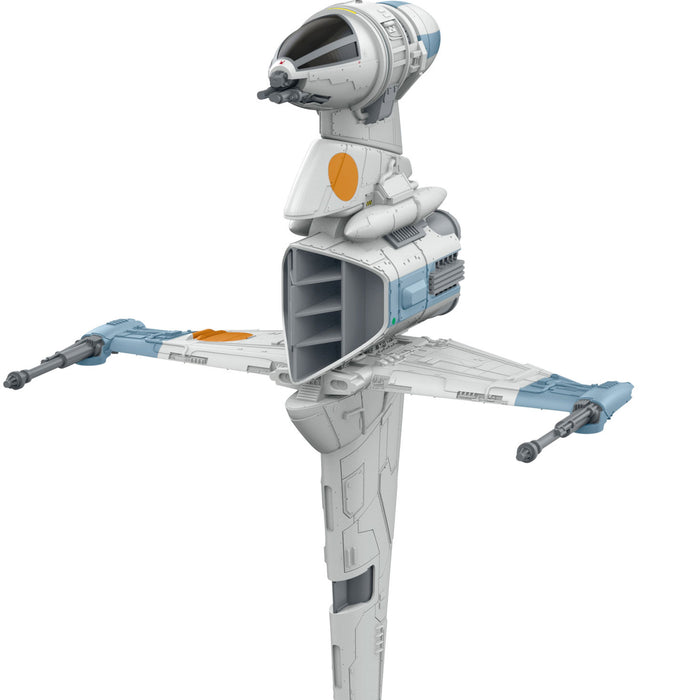 Toy model of a spacecraft with a white and gray color scheme on a white background