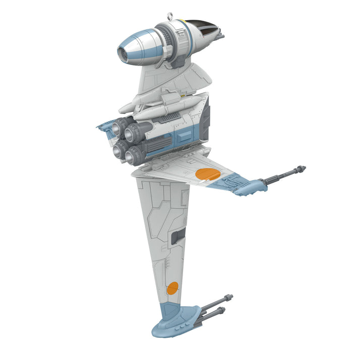 Toy model of a spaceship with a white and blue color scheme on a white background