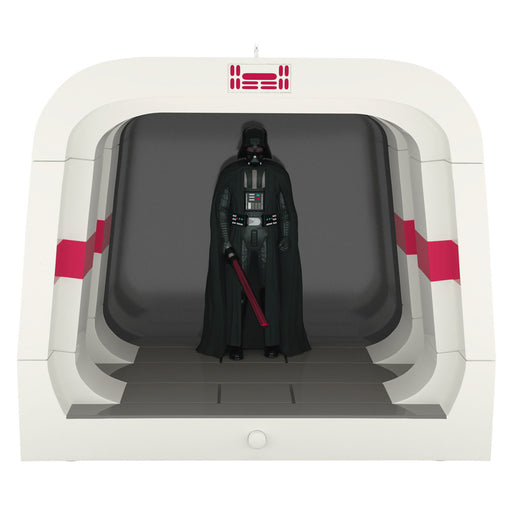Darth Vader figure in a white and red containment unit with 'HASBRO' branding.