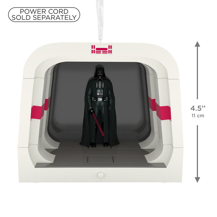 Darth Vader figure in a display case with a power cord sold separately label.