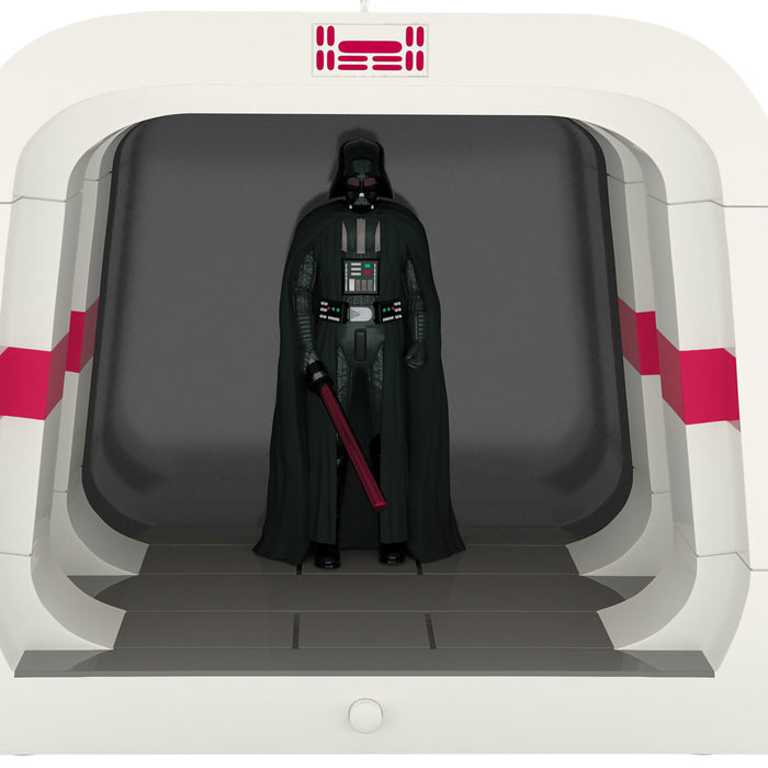 Darth Vader figure in a display case with a red light saber