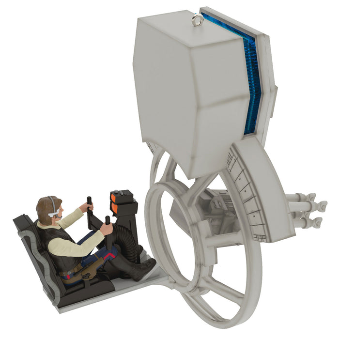 Toy model of a spaceship with a figure inside on a white background