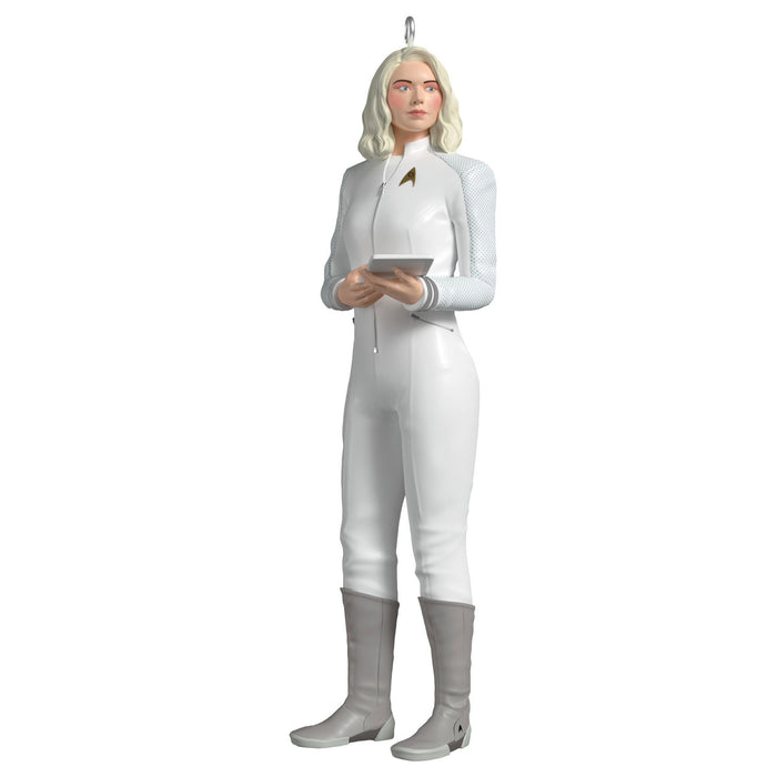 Decorative figure of a character in a white uniform with a tablet on a white background