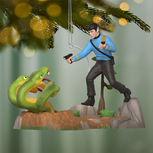 Figurine of a character from a science fiction series with a snake and tree in the background