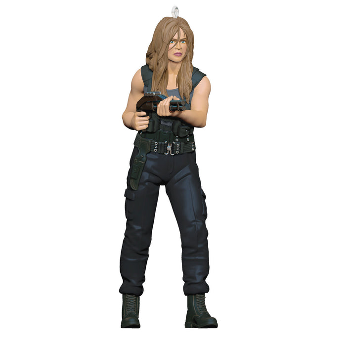 Action figure in tactical gear holding a gun on a white background