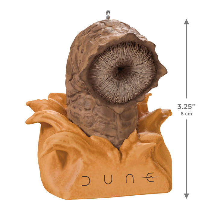 Decorative ornament resembling a character from 'Dune' with measurements indicated.