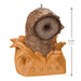 Decorative ornament resembling a character from 'Dune' with measurements indicated.