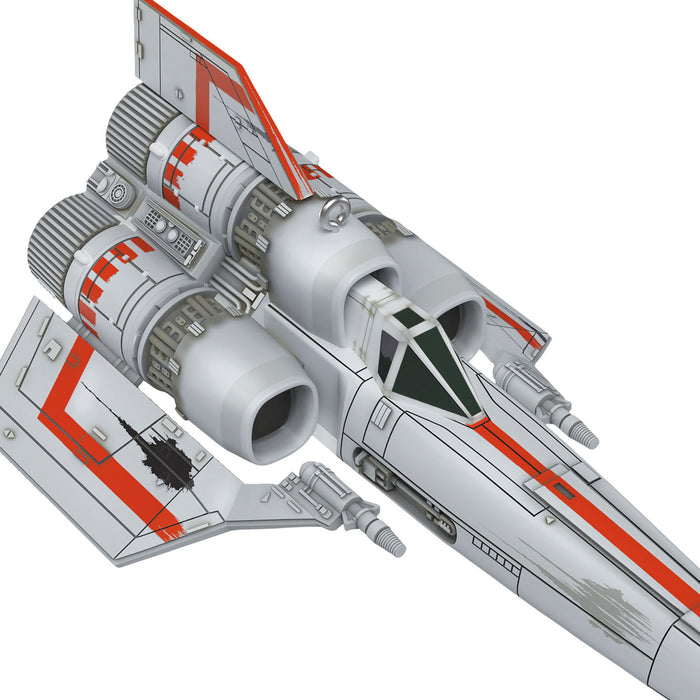 Model of a spaceship with red and gray design on a white background