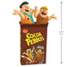 Two cartoon characters in a Cocoa Pebbles cereal box with dimensions indicated.