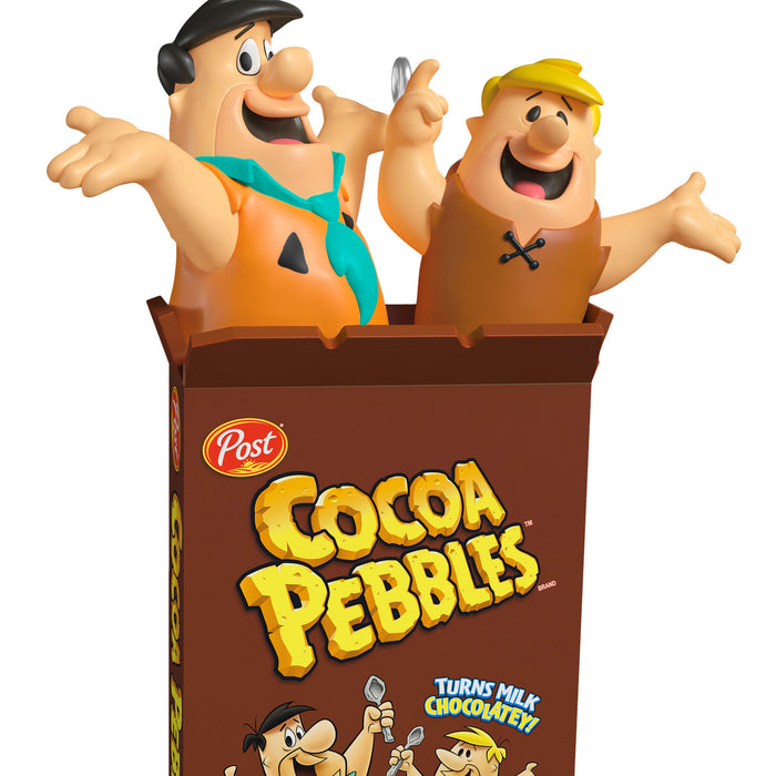 Cocoa Pebbles cereal box with cartoon characters on a white background