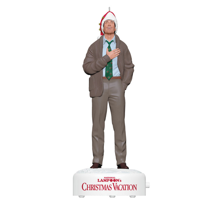 Statue of a man in a sweater and Santa hat on a 'National Lampoon's Christmas Vacation' box.