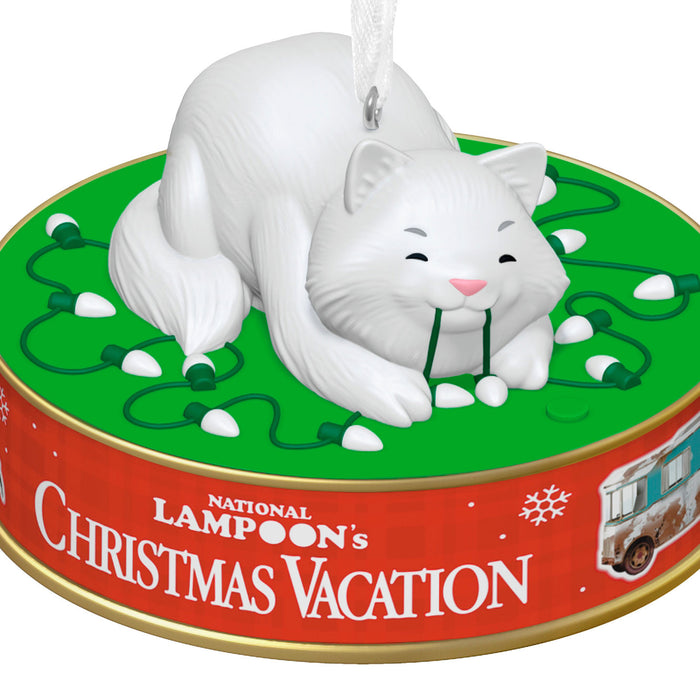 Cat ornament with green lights on a 'National Lampoon's Christmas Vacation' tin lid