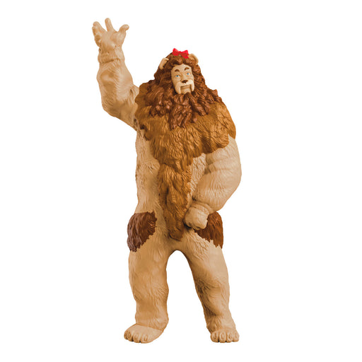 Toy figure of a character with brown fur and a red hat on a white background