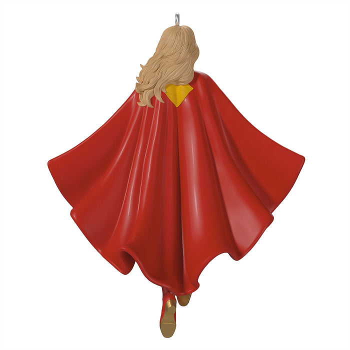 Decorative ornament of a character with a red cape and yellow top on a white background