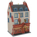 Model of a two-story building with a red roof and blue windows on a white background