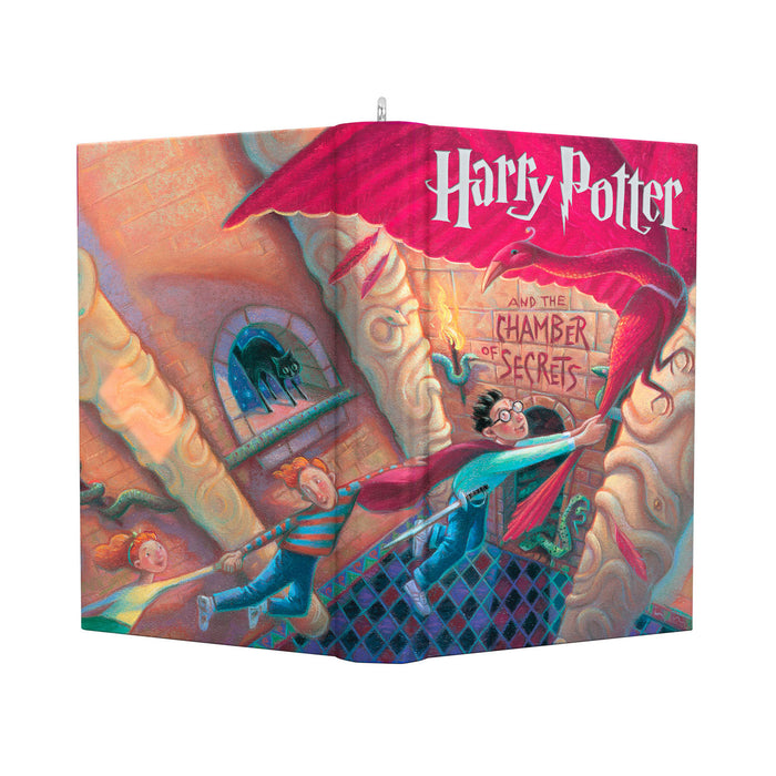 Book cover of 'Harry Potter and the Chamber of Secrets' with colorful illustration.