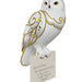 Decorative owl figurine with gold detailing on a white background
