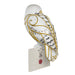 Decorative owl figurine with gold and black patterns on a white background