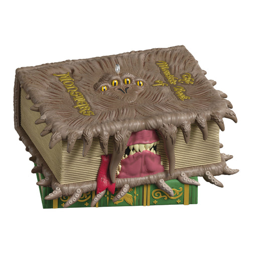 Monster book with a creature emerging from it on a white background
