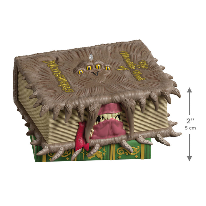 Toy figure of a monster emerging from a book with measurement indicators.
