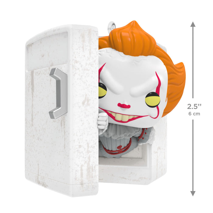 Joker figurine peeking out from a white box with dimensions indicated.