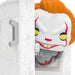 Funko Pop! vinyl figure of a character with orange hair and white face peeking out from behind a door.