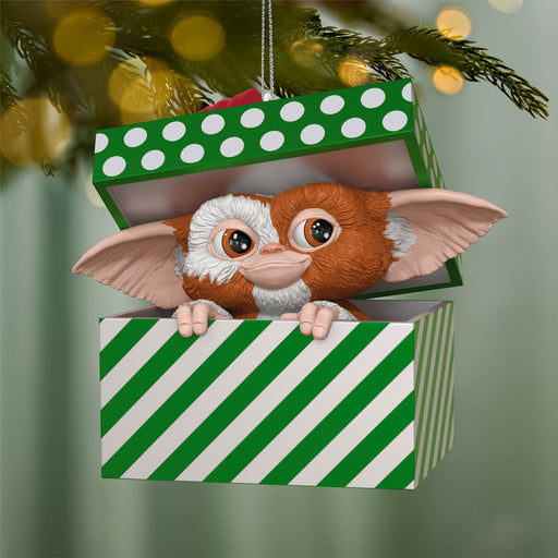 Gizmo from Gremlins in a green and white striped box Christmas ornament.