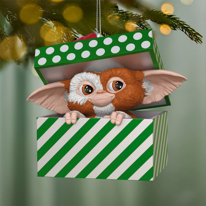 Gizmo from Gremlins in a green and white striped box Christmas ornament.