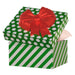 Open gift box with green and white polka dot design and red bow on a white background