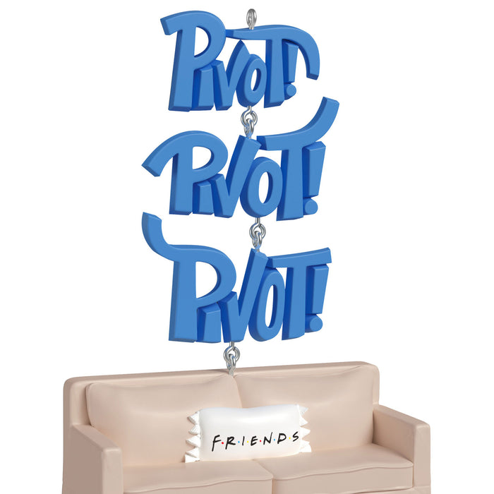 Blue 'Pivot' sign hanging above a beige couch with a 'Friends' pillow.