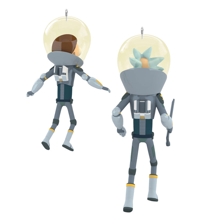Two astronaut figurines with different hairstyles on a white background