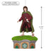Decorative figure of a character in a green cloak and red robe standing on a small house with grass roof, dimensions indicated.