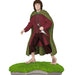 Figure of a character in a red coat and green cloak standing on grass with a white background