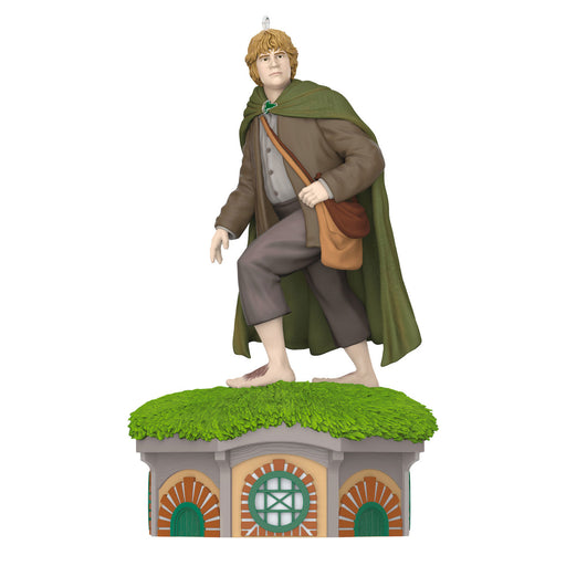 Figure of a character with a green cloak and brown bag on a grassy platform with architectural design.