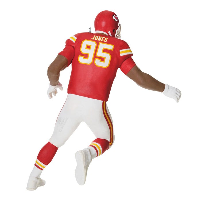 Football player figure in red and white uniform with 'Jones' and number '95' on a white background