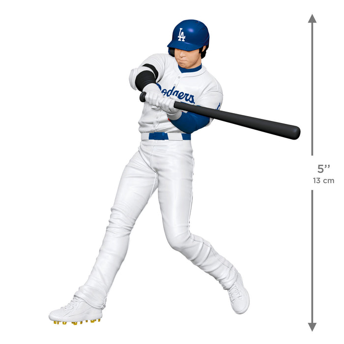 Baseball player figure in white and blue uniform with bat, Los Angeles Dodgers logo, and measurement chart on a white background.