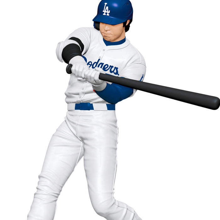 Baseball player in Los Angeles Dodgers uniform holding a bat on a white background