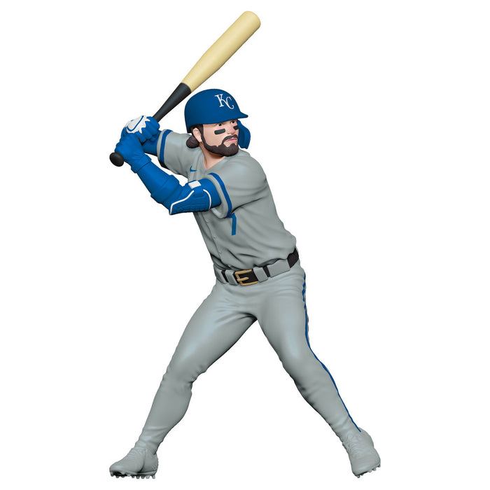 Baseball player figurine in gray and blue uniform with bat on white background