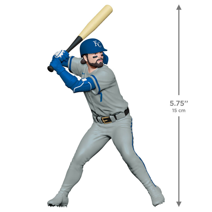 Baseball player figurine in gray and blue uniform with bat, measurement label on a white background