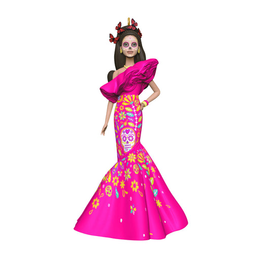 Doll in a vibrant pink dress with colorful patterns on a white background