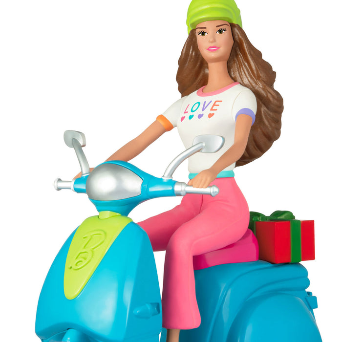 Toy figure of a girl on a scooter with a white background
