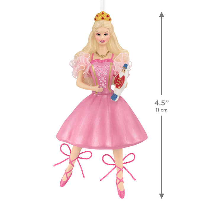 Princess figurine in a pink dress holding a Nutcracker, with measurements indicated.