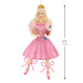 Princess figurine in a pink dress holding a Nutcracker, with measurements indicated.