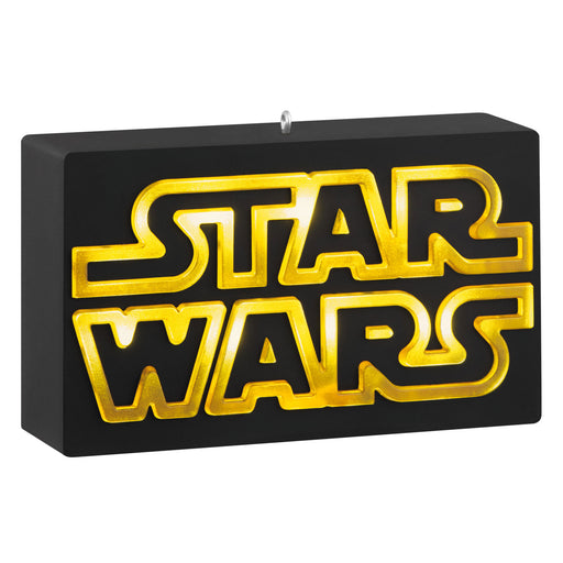 Star Wars logo ornament on a black base with gold text