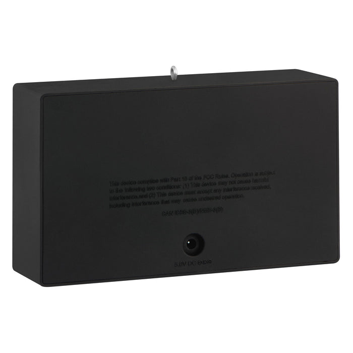 Black rectangular electronic device with text on a white background