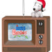 Snoopy wearing a Santa hat on top of a vintage TV set with 'A Charlie Brown Christmas' on screen.