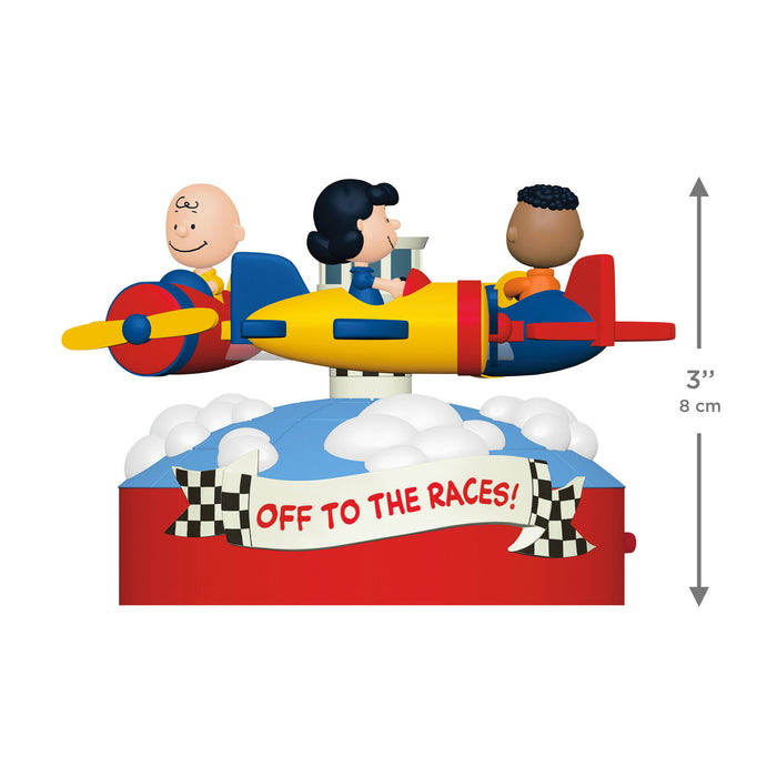 Colorful toy airplane with three cartoon characters inside, labeled 'Off to the Races!', on a white background.