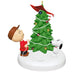 Christmas ornament featuring a boy and dog near a decorated tree on a white background